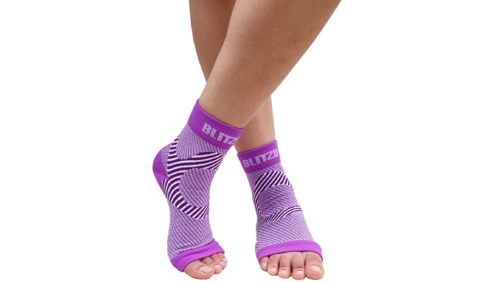 Person wearing purple compression sleeves.