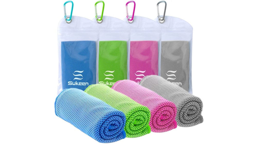 Four colorful mesh towels rolled up in front of their plastic storage bag.