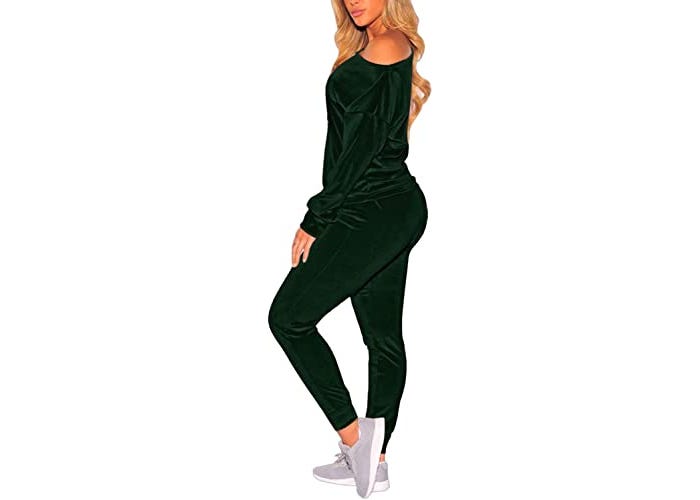 Side view of woman in matching cold shoulder long-sleeved shirt and jogger workout suit