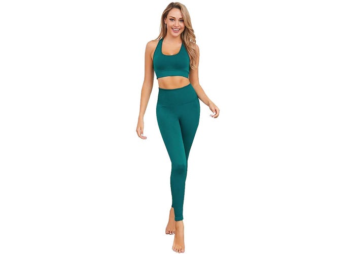 Blonde model in matching green high waisted leggings and sports bra.