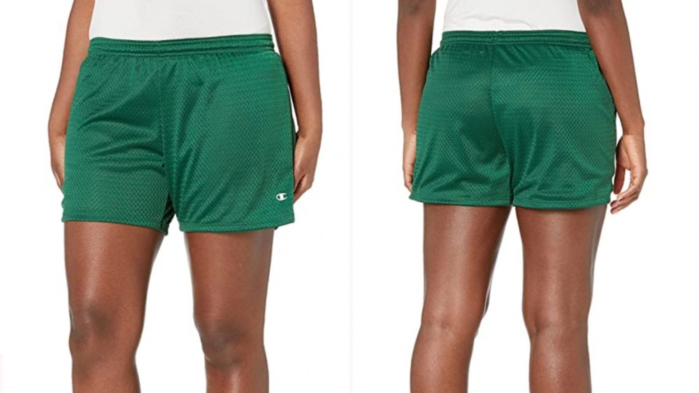 woman wearing green athletic shorts with elastic waistband