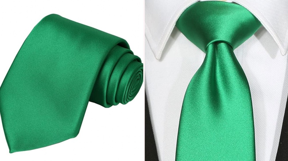 a green shiny necktie rolled up and on a neck over a white collared shirt