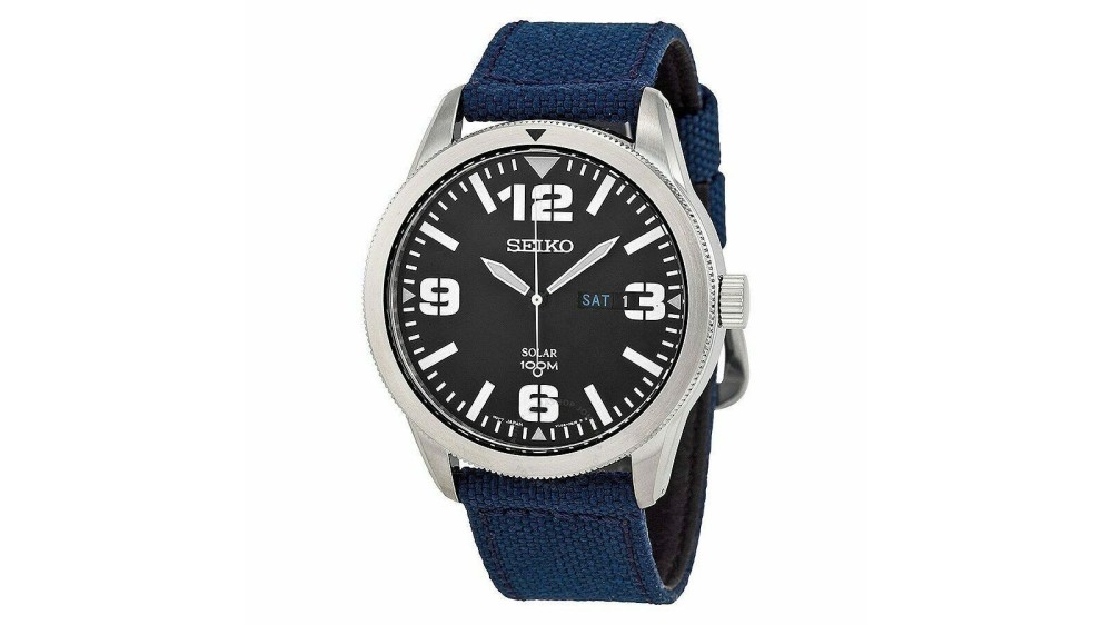 a sports watch with a navy blue elastic band and black numbered watch face