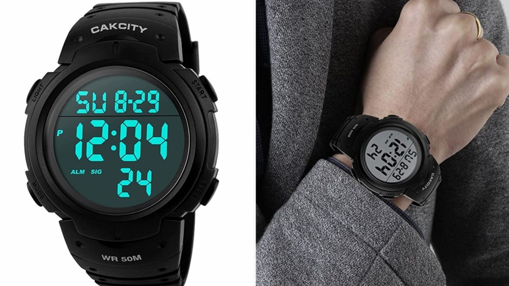 a black digital sports watch with aqua numbers shown on a man's wrist