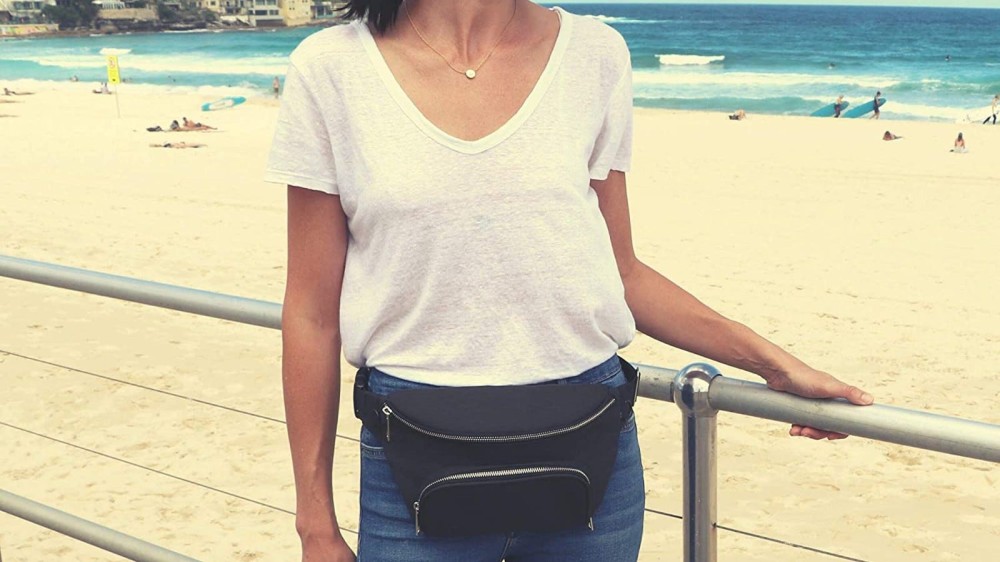 woman in white t-shirt wearing black belt bag