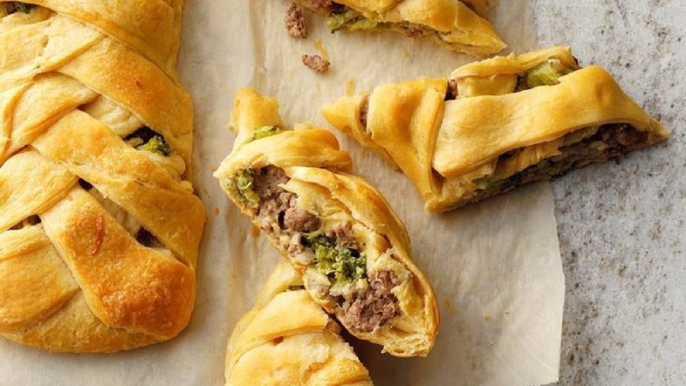 An image of a braided beef and broccoli dinner encased in crescent rolls. 