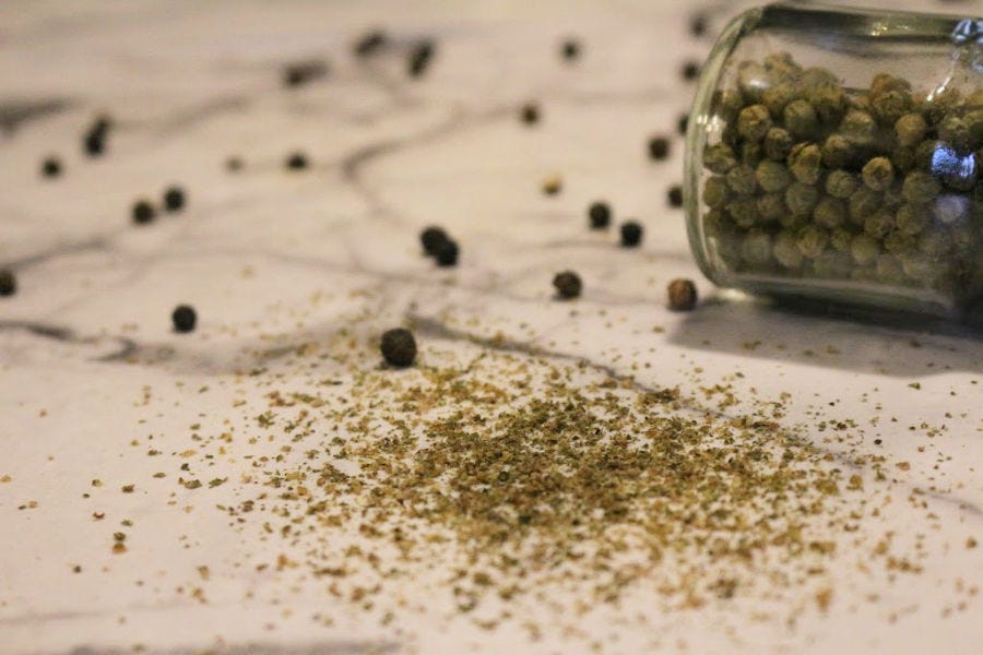 Freshly cracked green peppercorns