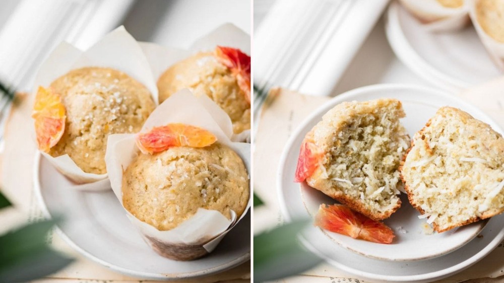 Three orange coconut muffins on a plate; a muffin broken open with a slice of blood orange on a plate