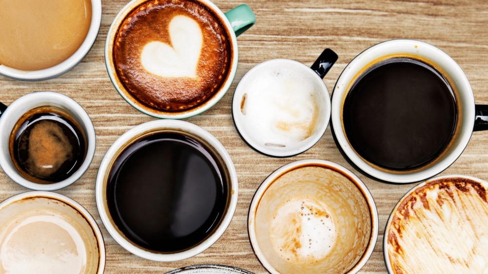 Various coffee and espresso drinks taken in an aerial view image.