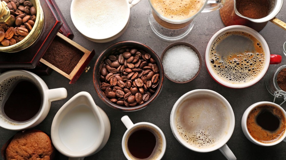 Different types of coffee dirnks displayed in an overhead shot image.