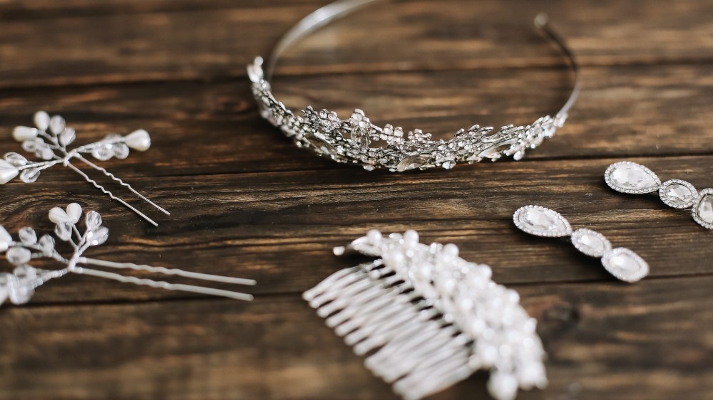 Bridal hair accessories on a wooden table.