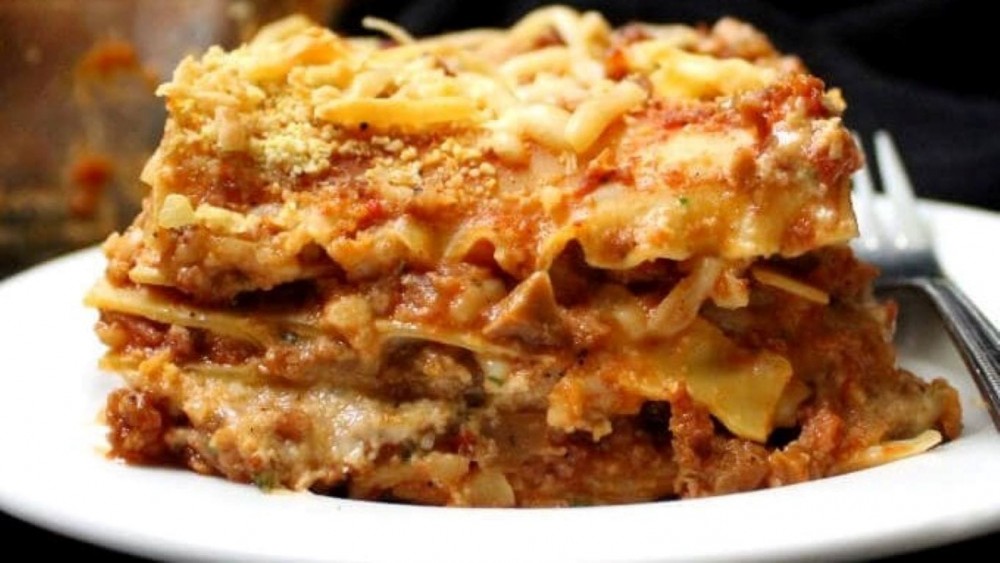 A slice of vegan lasagna on a plate.