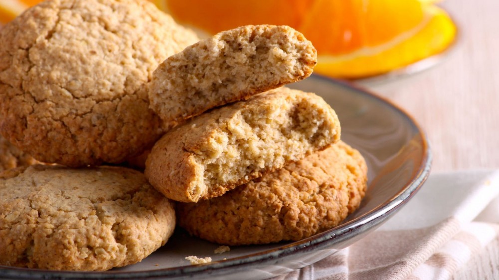 Orange and ginger cookies on a plate.