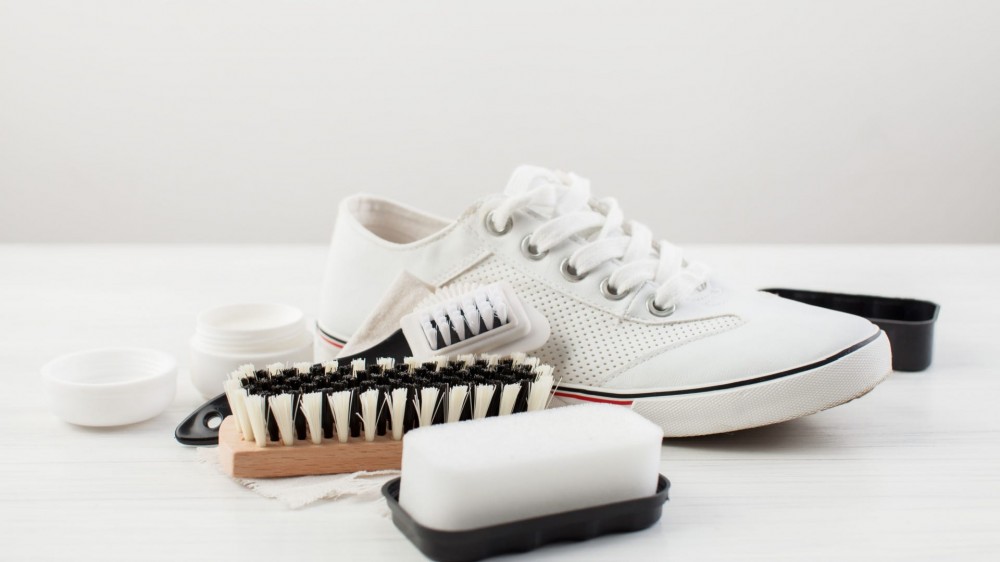 White sneaker with shoe brush.