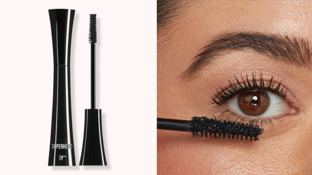 A person applies mascara to their lower lashes.